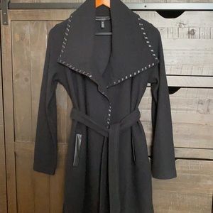Cozy wool like sweater coat with leather trim edging and pockets.